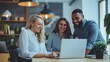 © pkproject - Diverse Business Colleagues Collaborating on Laptop in Casual Workspace