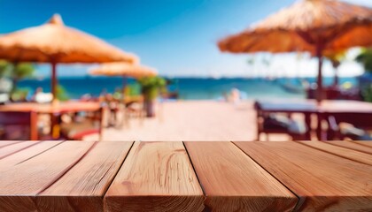 Canvas Print - empty wooden table top with copy space for food drink product advertising with blurred summer resort beach bar restaurant background