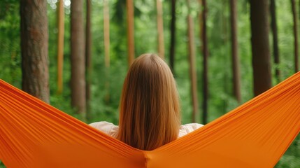 A woman tying a hammock between two trees, preparing for a peaceful day in the forest hammock, forest, tree interaction