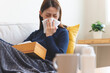 © Pormezz - asian woman blowing nose and have allergy