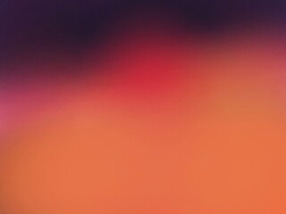 Wall Mural - A blurry orange background with a red object in the foreground