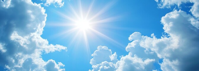 Shining sun through fluffy clouds on blue clean sky background