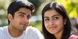 © Mark G - A close-up portrait of a young Indian or Pakistani couple wearing casual t-shirts, with a blurred background.