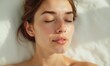 © junet - serene young woman, glowing skin, closed eyes, soft light, minimalistic background