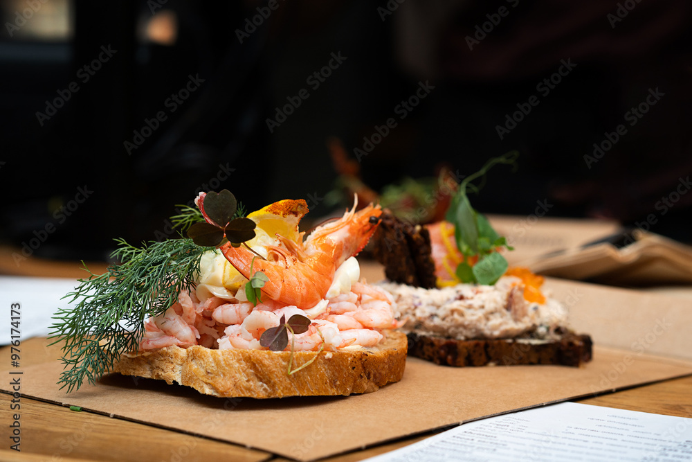 The traditional Danish smorrebrod pairs dark rye bread with shrimp ...