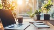 © Farhad - Home office desk workspace with laptop coffee and notebook at sunrise