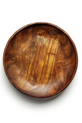 Poster - A close-up shot of a wooden bowl placed on a white surface, ideal for food or craft photography