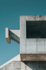 Poster - A modern concrete building stands out against a clear blue sky with white clouds