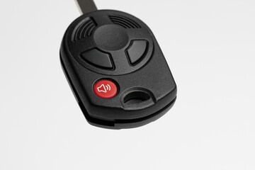 Emergency panic button on car key FOB. Vehicle alarm, security and safety system concept