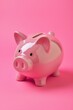 © Alena - A pink piggy bank on a pink background
