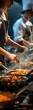© kramynina - Several people cooking food in a kitchen with a lot of cooking utensils, cooking class