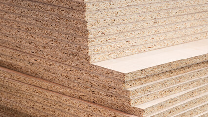 Poster - A stack of wood planks with a grainy texture. The wood is stacked on top of each other, creating a pyramid shape. Concept of stability and strength, as the wood planks are stacked securely and firmly