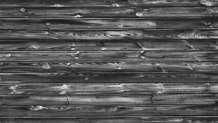 Poster - A black and white photo of wood grain. The photo is of a wooden surface with a lot of texture and detail. The photo has a vintage feel to it, and the grain of the wood is very prominent