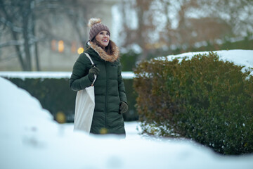 happy 40 years old woman outdoors in park in winter