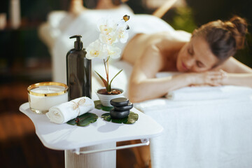 Poster - Relaxed woman in massage cabinet laying on massage table