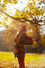 smiling woman in red hat rejoicing