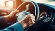 © Pascal - Image of man holding steering wheel, with focus on hands and the steering mechanism
