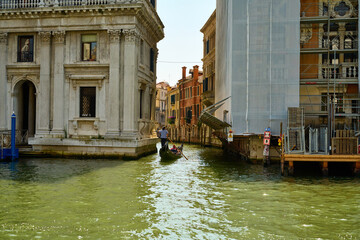 Venice and its buildings,canals,gondolas,and sculptures