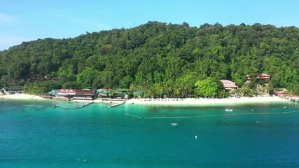 Wall Mural - Drone, island and ocean for a holiday resort in Raja Ampat, Indonesia. Pacific ocean, aerial and freedom for tropical vacation from the shore in paradise for relaxed adventure in a scenic bay