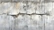 © Morng - Cracked concrete wall with visible damage and texture. Suitable for construction, deterioration, and structural integrity themes.