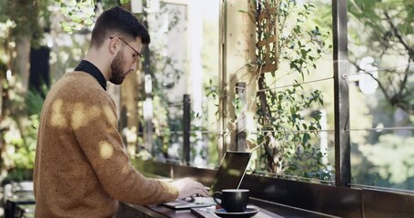 Poster - Typing, man and a laptop at a cafe for remote work, writing email or reading. Serious male freelance worker with computer and connection for copywriting, research or web with a drink at coffee shop