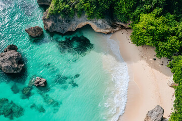 Wall Mural - Aerial view of a beautiful secluded beach with turquoise water and white sand.