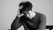 © ABX - Stressed Man with Hand on Head in Contemplation