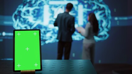 Poster - Green screen tablet used by computer scientists in startup doing advancements in AI field. Employees working on mockup device in workspace featuring artificial intelligence systems, camera B