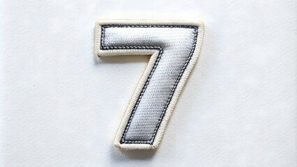 number 7 embroidered patch on a white background, number, seven, 7, patch, embroidered, white, backg