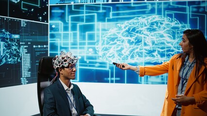 Poster - Presenter talking at AI neuroscience forum bringing together IT professionals, showing EEH headset demonstration of latest developments in artificial intelligence mind transfer, camera B
