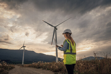 Poster - A Wind Energy Technician is meticulously inspecting a towering turbine set against a breathtaking scenic landscape, ensuring it operates efficiently and contributes to sustainable energy production