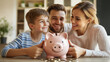 © Natalia Klenova - Happy young family saving money together with a piggy bank