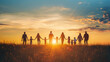 © Ruslan - Silhouette of group of people holding hands in field at sunset. International day of peace