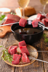 Wall Mural - Fondue Bourguignonne with Beef, Oil, and Wine – Gourmet Dining Experience