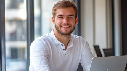 Poster - Happy, Young Professional Focused At Work Businessman On Laptop In Modern Office By Window