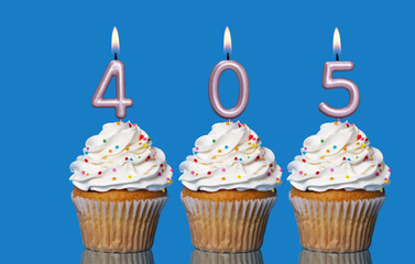 Birthday Cupcakes With Candles Lit Forming The Number 405