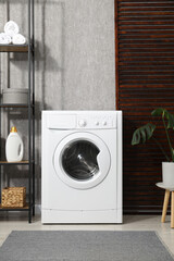 Canvas Print - Washing machine, towels and detergents in laundry room