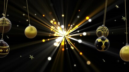 Wall Mural - Swinging black and gold christmas baubles over starburst with light spots on black background