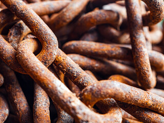 Backgrounds and textures: links of very old weathered rusty chain, close up shot, industrial abstract rusty chain, macro