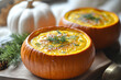 © Weerapat - Delicious pumpkin soup served in small pumpkin bowls, perfect for autumn gatherings or cozy meals.