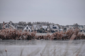 Wall Mural - A Dutch village frozen and covered with snow in the winter season