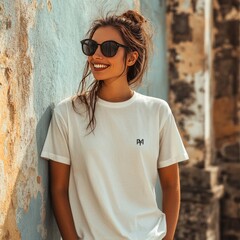 Sticker - A smiling woman in a white t-shirt poses against a textured wall.