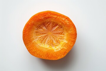 A fresh orange cut into two halves on a white surface