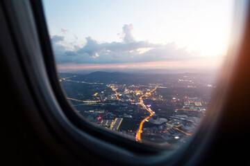 Wall Mural - aerial view of through airplane window