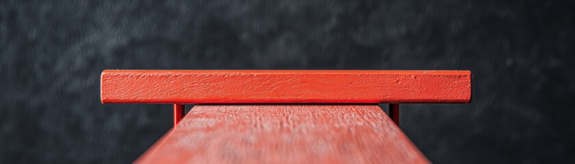 Poster - Minimalistic graphy featuring a vibrant red wooden bench against a dark, textured background, showcasing a sleek and modern design.