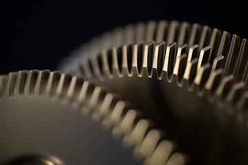Wall Mural - highly detailed close-up of two interconnected gears | precision engineering and mechanical design