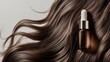 © tinnakorn - Beautiful hair serum bottle placed on shiny brown hair, ideal for beauty and hair care advertising.