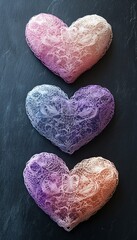 Wall Mural - Three lace-patterned heart shapes in gradient colors.