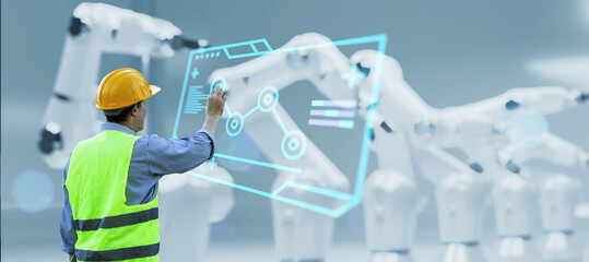 Leinwandbilder - Engineer monitoring robotic AI arms in manufacturing factory plant, manager managing controlling using computer holographic ui display analysis innovation technology, male engineer, banner background.