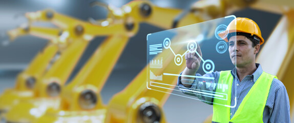Leinwandbilder - Engineer monitoring robotic AI arms in manufacturing factory plant, manager managing controlling using computer holographic ui display analysis innovation technology, male engineer, banner background.
